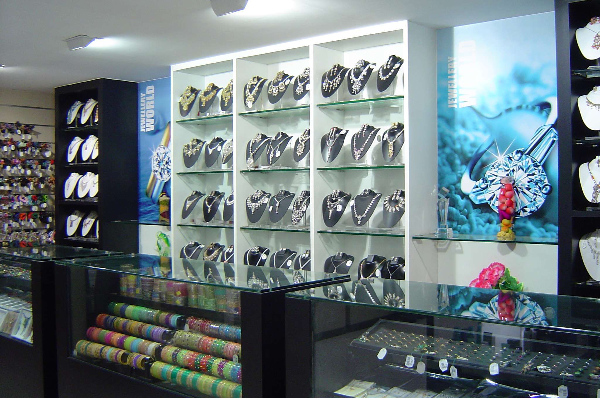 Fashion jewellery counter in a retail store at Ooty, Tamilnadu, featuring elegant display shelves with imitation necklaces, earrings, bangles, and rings done by interior designers and contractors specializing in retail jewellery showroom interiors and display solutions.
