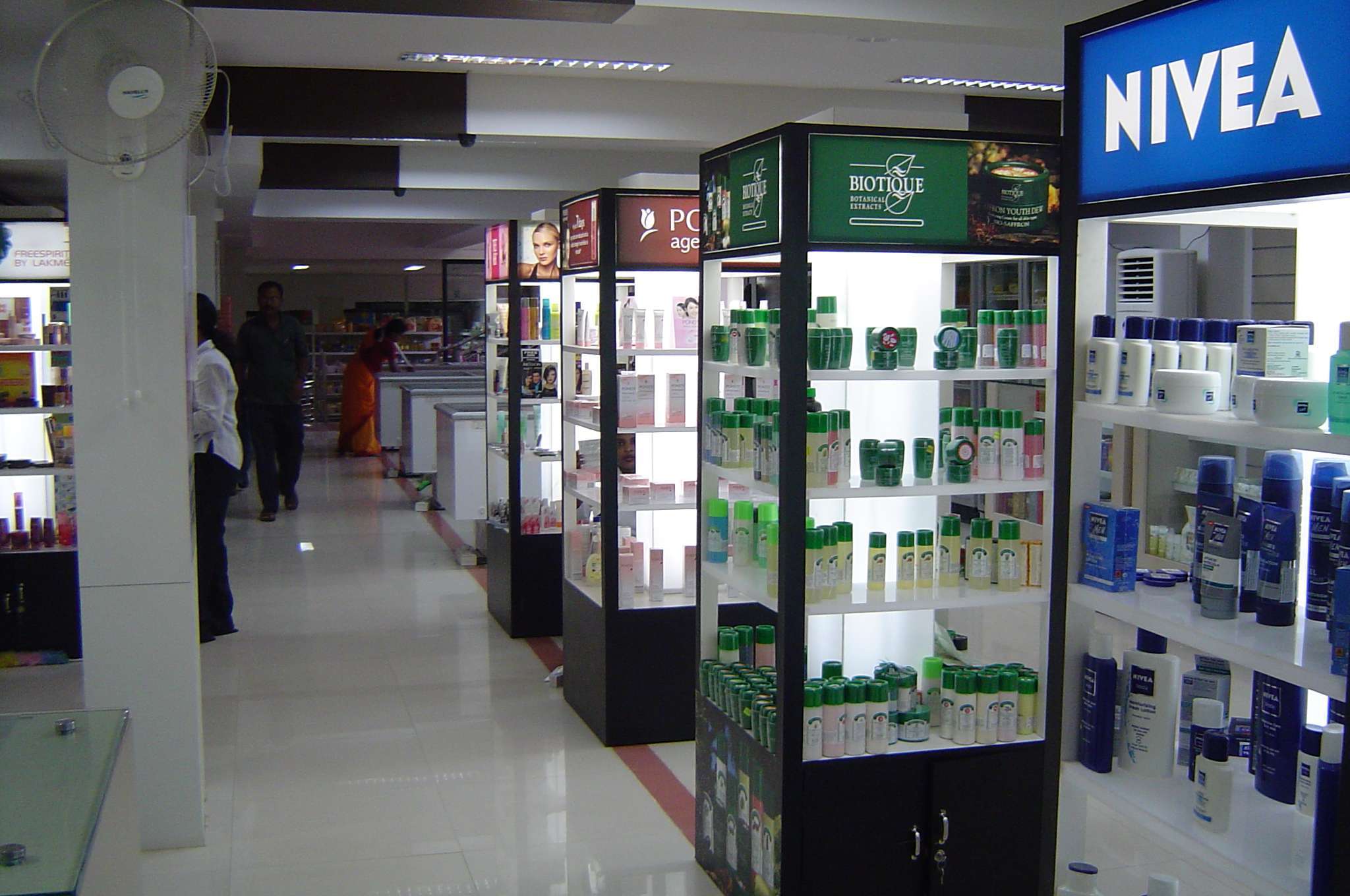 Cosmetic counter interior at a retail store in Pollachi, Coimbatore, showcasing branded skincare displays from Biotique, Nivea, and Ponds — by interior designers, contractors, and retail fixture manufacturers specializing in personal care and beauty store layouts.