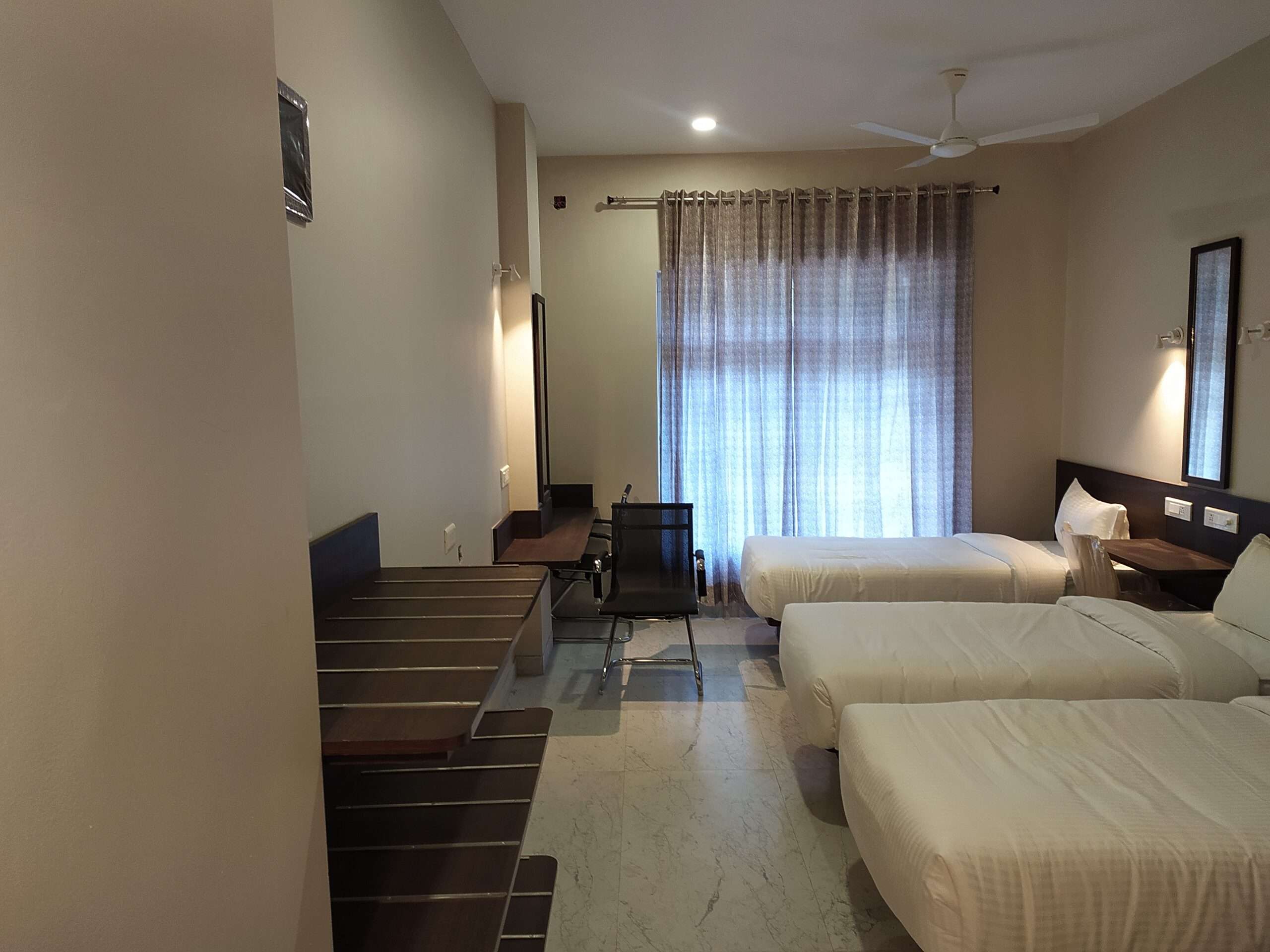 Budget friendly, Minimalist hotel room interior done with plywood in Tamilnadu - hospitality project contractors specializing in budget-friendly accommodation design