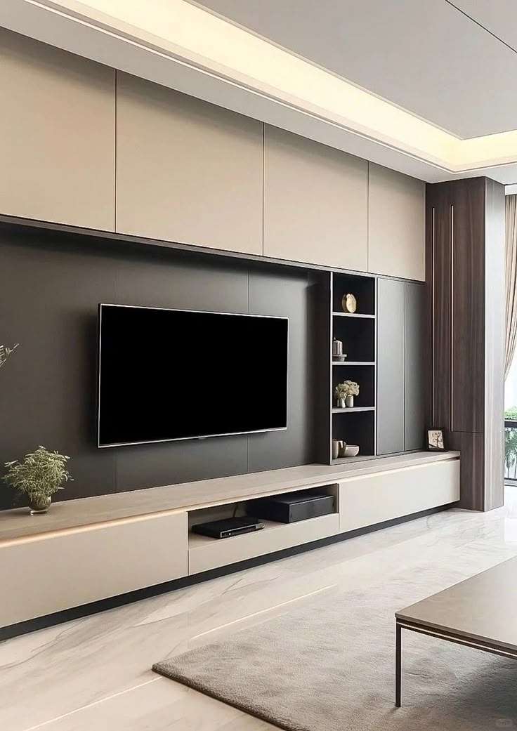 Elegant living room with a modern TV unit featuring handleless cabinetry, open shelving, and a matte grey and wood finish at a residence in Chennai, Tamil Nadu.
